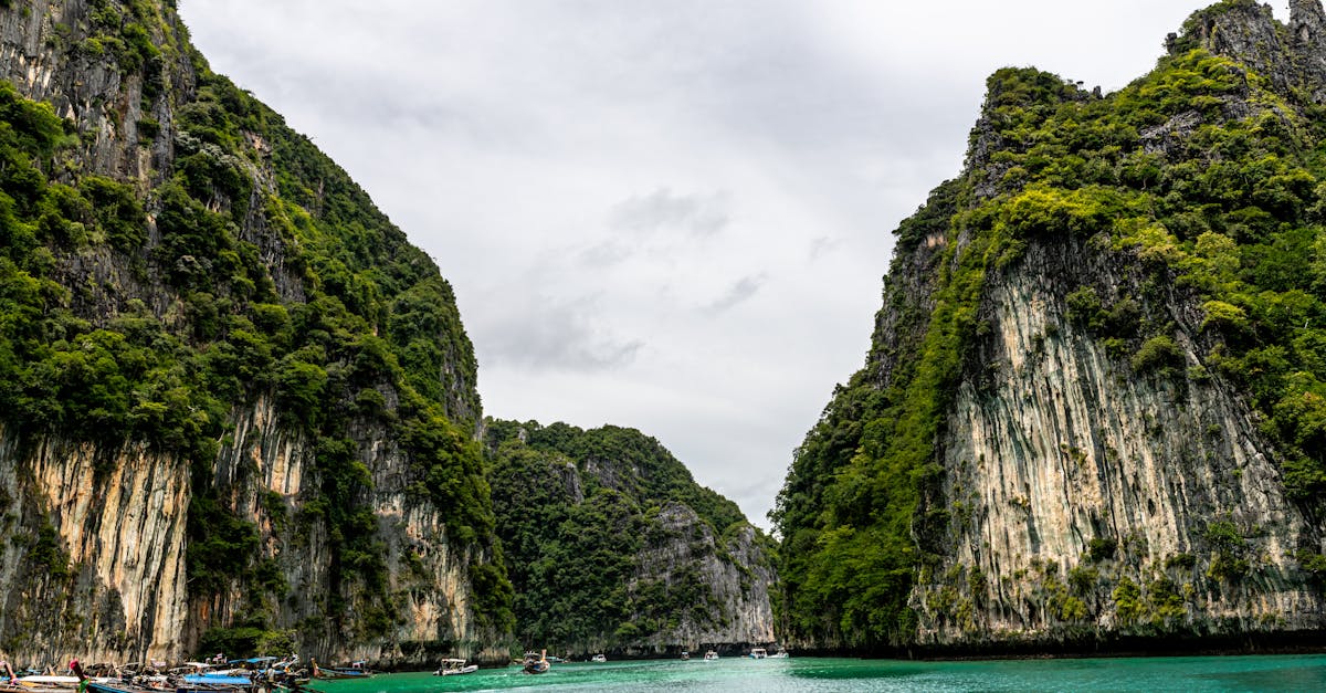 Stunning view of emerald waters surrounded by cliffs in Phuket, Thailand.